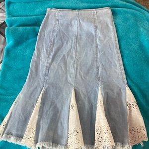 Light blue Jean skirt in size small with white embroidery